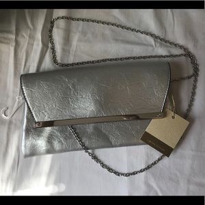 Silver clutch purse with cross body chain NWT